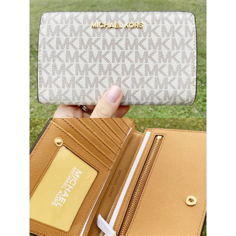 how much does a michael kors wallet cost